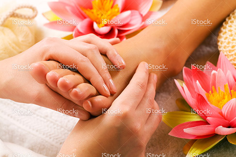 reflexology being performed on a clients foot